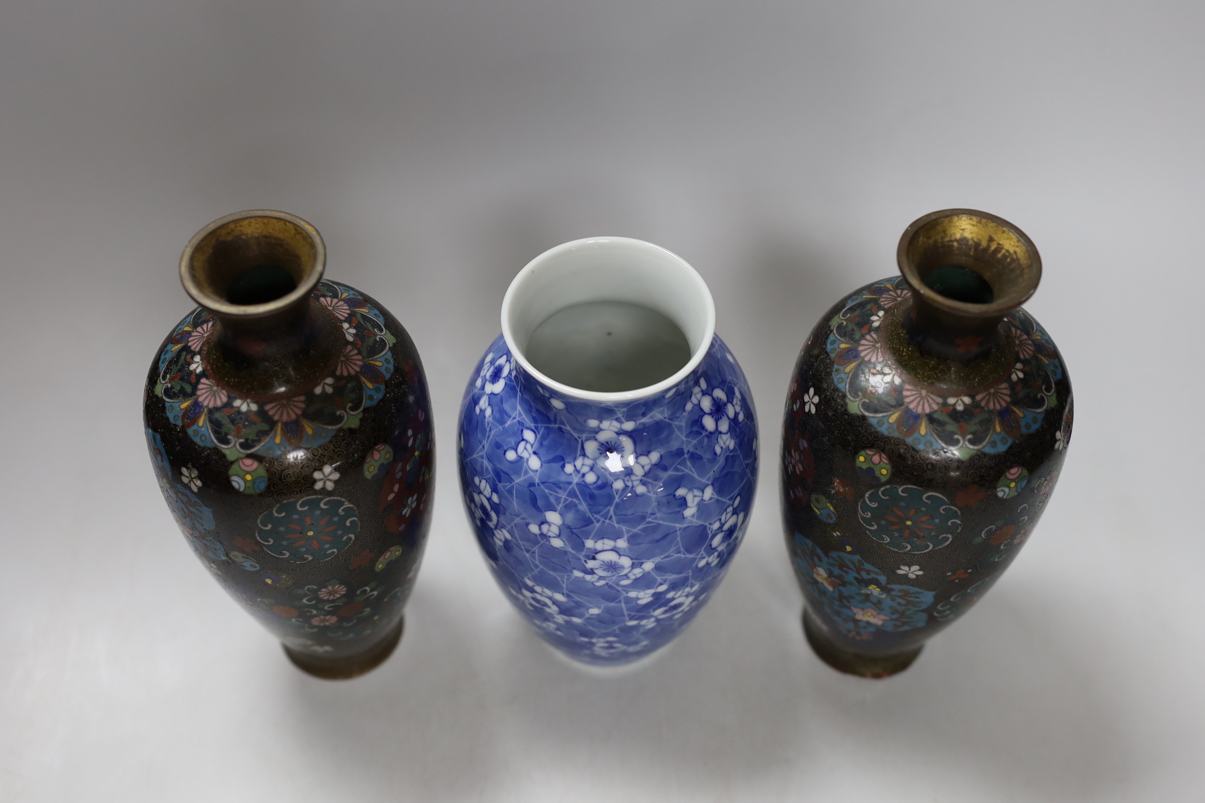 A pair of Japanese cloisonné enamel vases, four Japanese vases and an antimony dish. Tallest 22cm